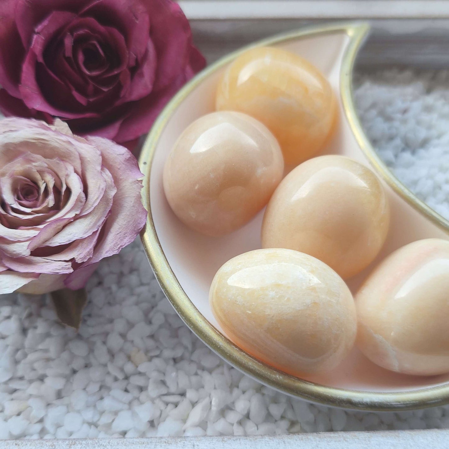 Orangencalcit Trommelstein